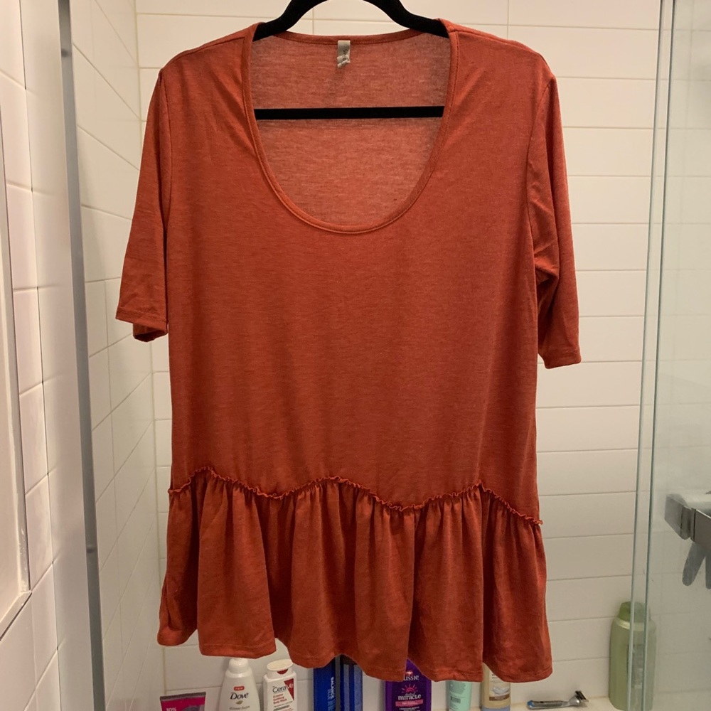 Burnt orange peplum top